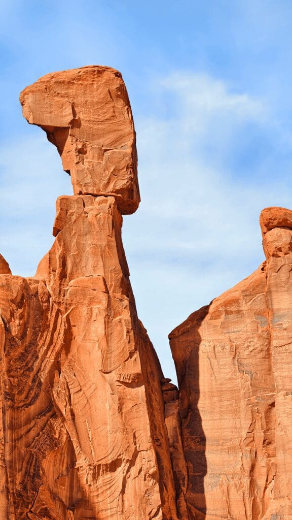rocks perched on top of rock columns that look to be falling