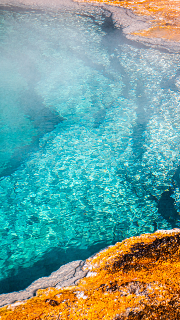 view from above of painted pots with blue water and brown crust on edges