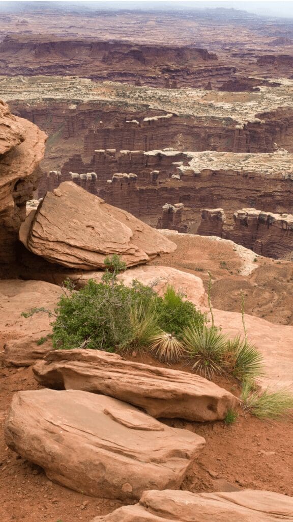 rocks perched high on hill overlooking valley
