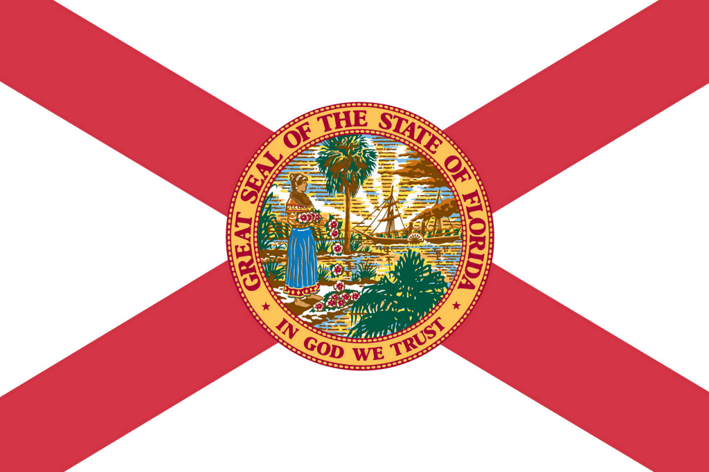 a red X on a white flag with a round seal in the middle