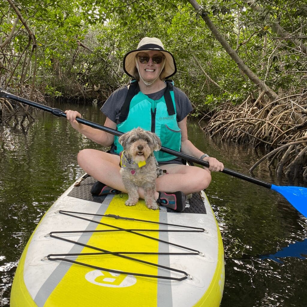 Bev on paddleboard with annie