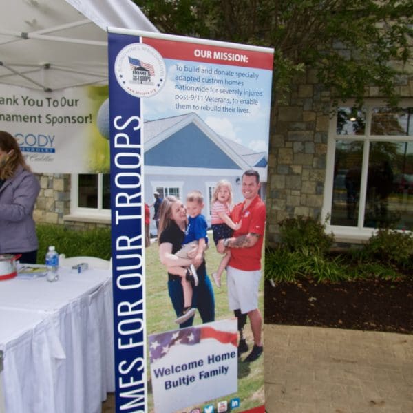 sign at Homes for Our Troops (HFOT) golf tournament