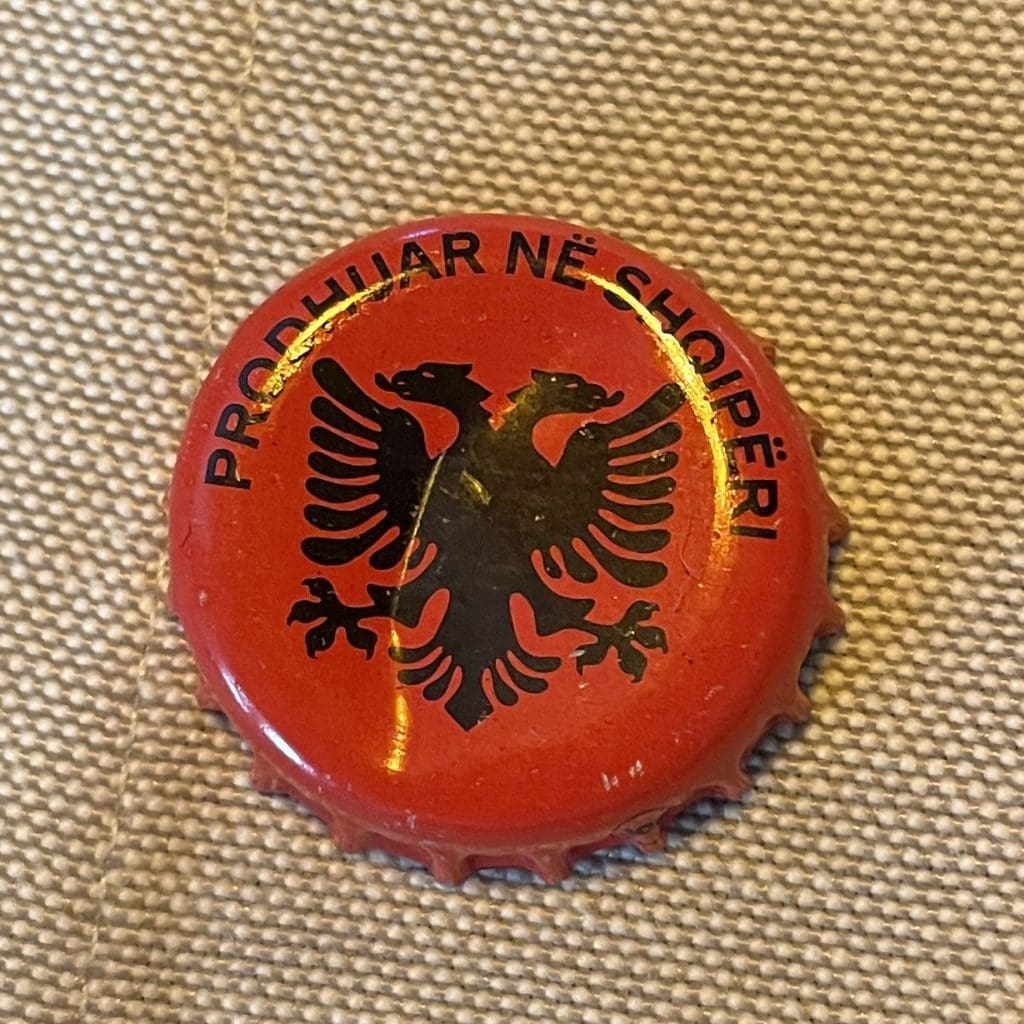 red coke botte top with Albanian flag