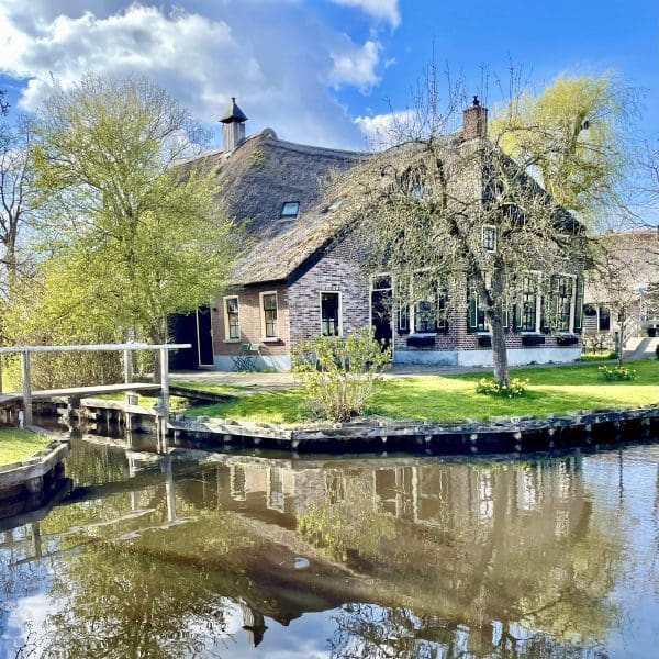 cottage along the water with reflection in Giethoorn Netherlands
