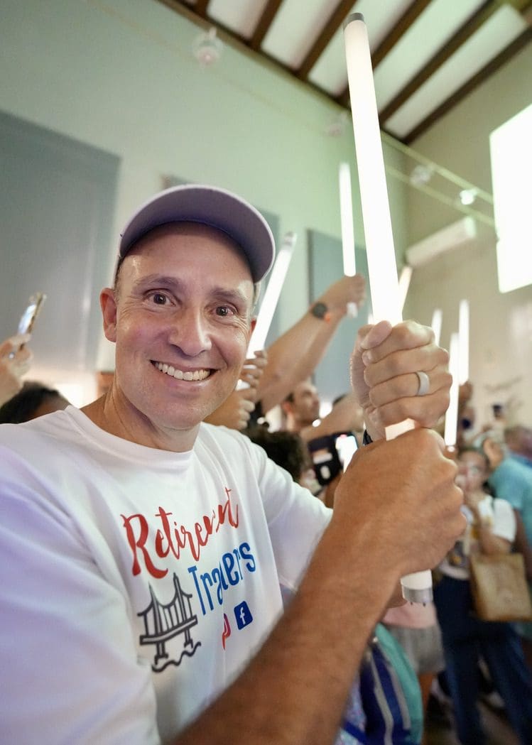 john holding a lightbulb that is lit