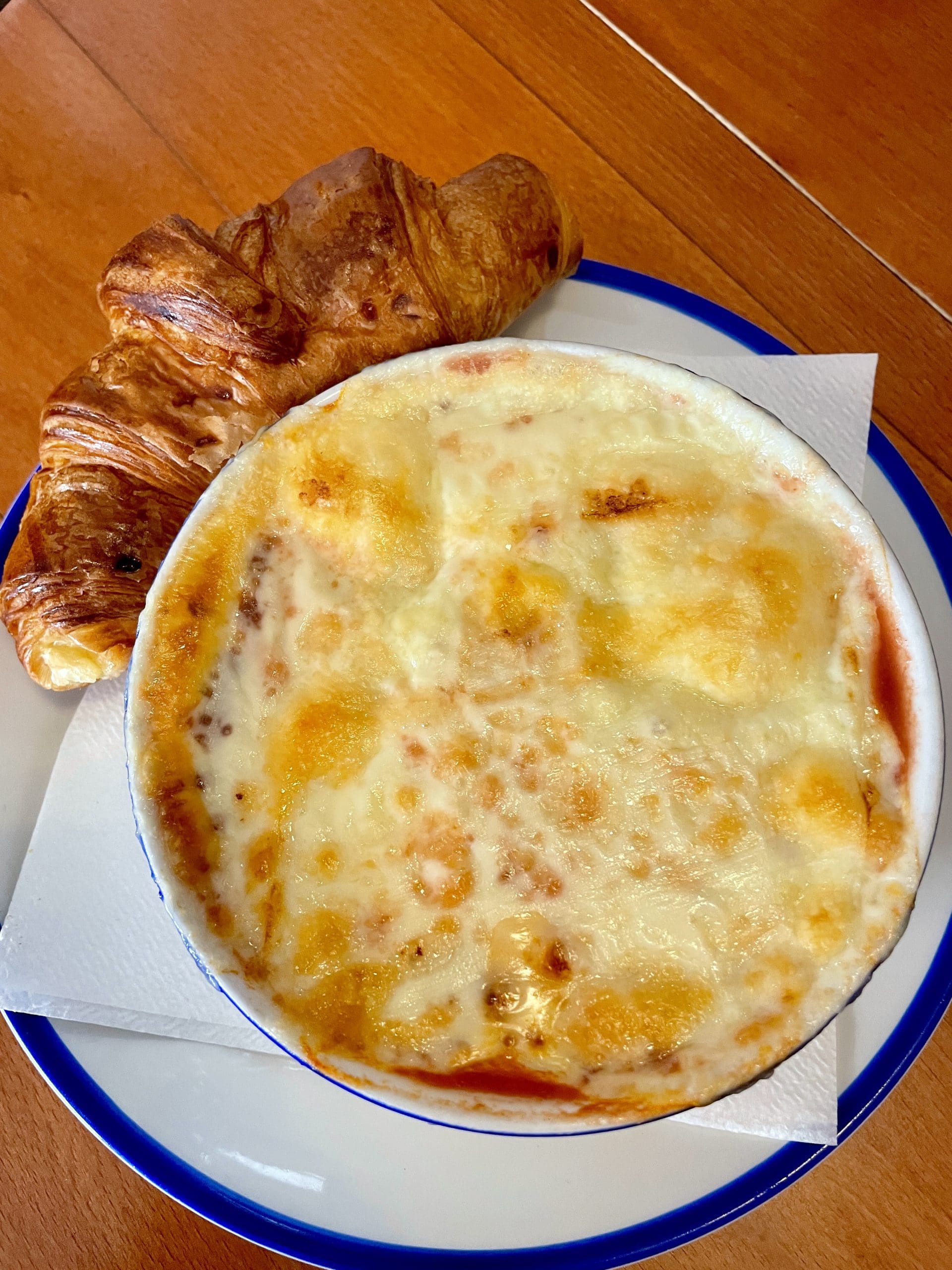 soup in bowl with cheese on top