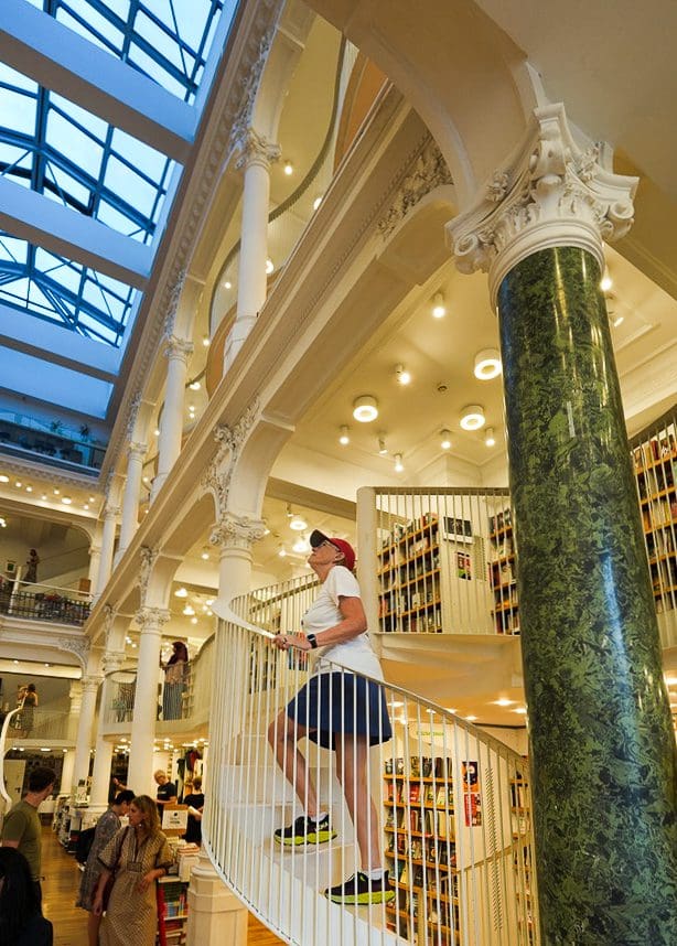 bev climbing stairs at bookstore