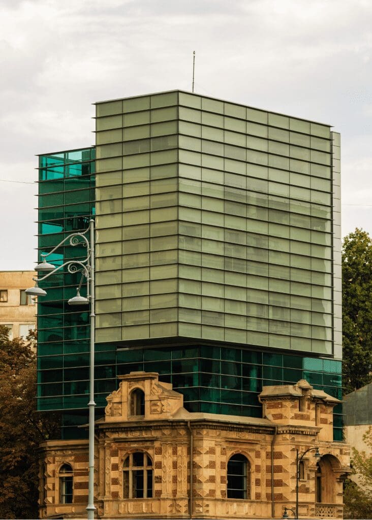 a building with classic architecture with glass modern top
