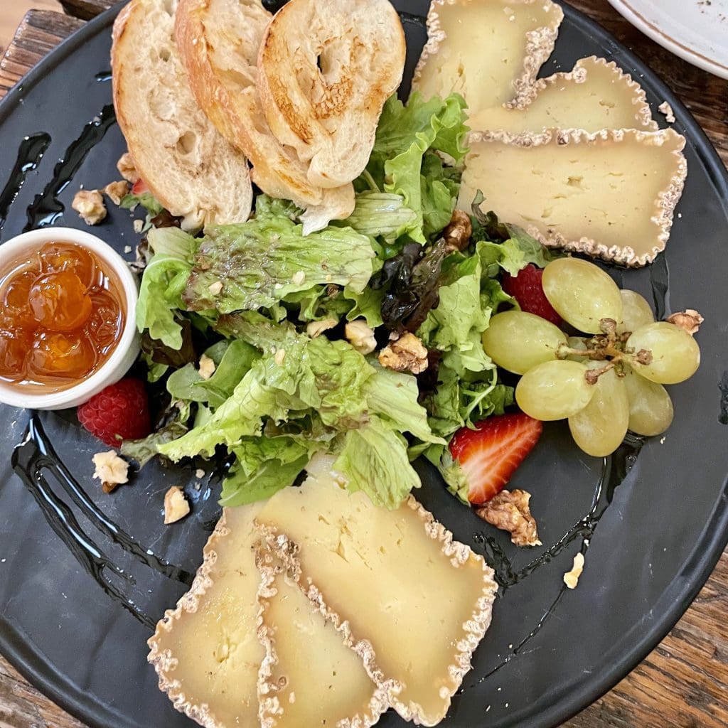 a plate of greenish cheese made locally in Bulgaria