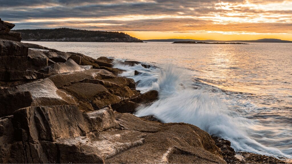 a sunrise over the atlantic ocean at acadia national park