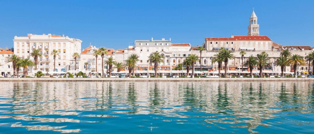 a view from the blue water of the Adriatic Sea with Old Town in the background