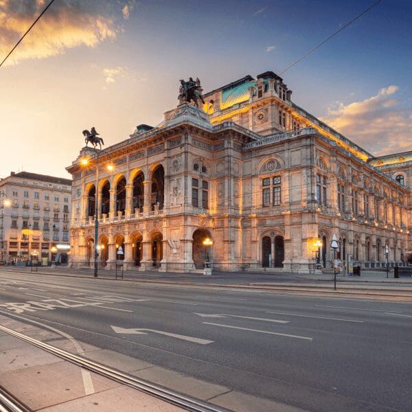city scene of opera house and red tram