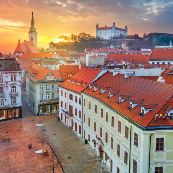 A view of the square and church with Bratislava Castle in background