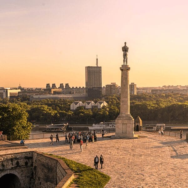 a view of the statue at sunset