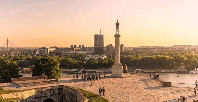 a view of the statue at sunset