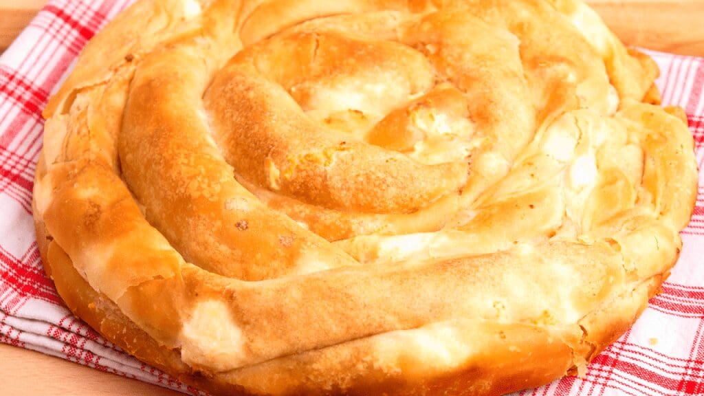 a golden pastry with cheese inside