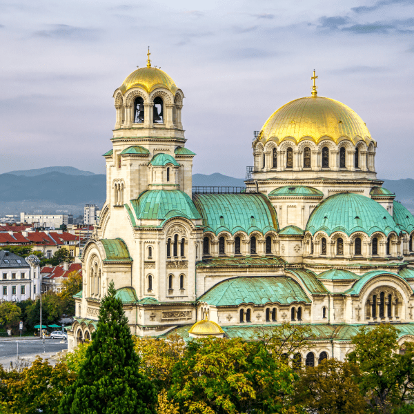 huge cathedral with green roofs and gold domes