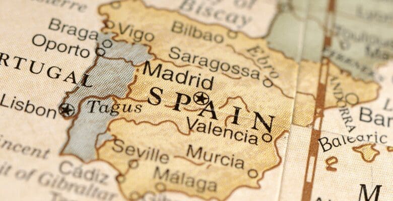 a golden map with Spain and Madrid in the middle