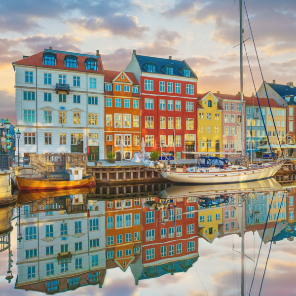 Canal in Copenhagen Denmark with colorful houses reflecting in the water