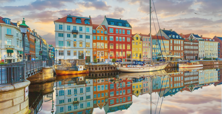 Canal in Copenhagen Denmark with colorful houses reflecting in the water