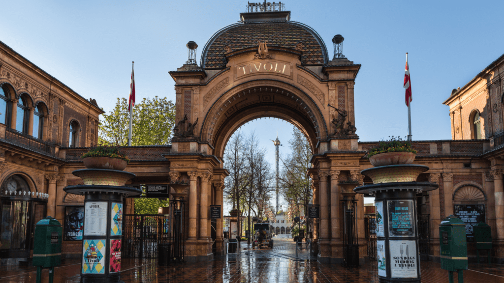 AN ORANGE ARCH ENTRY WITH A WALL