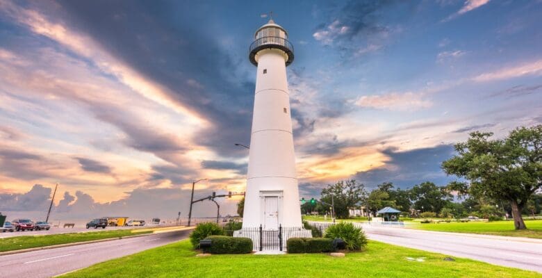 A lighthouse with a beautiful setting sun.