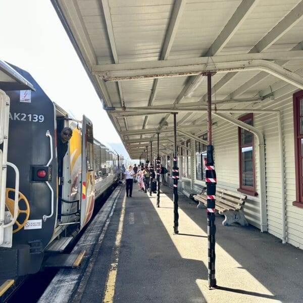 Train stopped at a train station passenger loading area