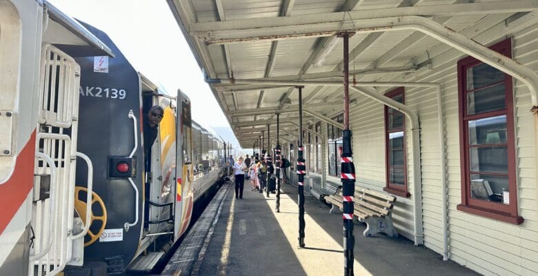 Train stopped at a train station passenger loading=