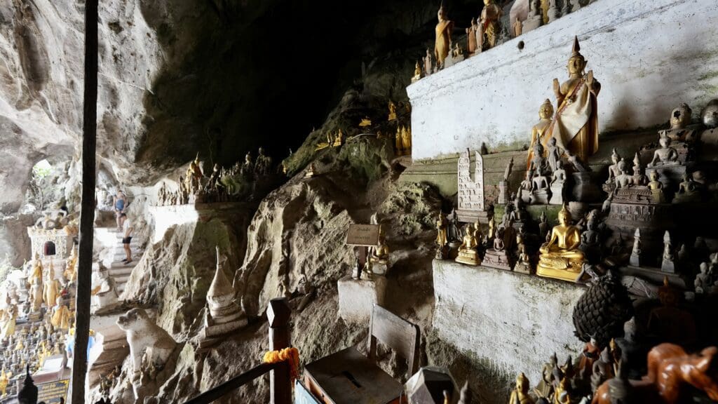 hundreds of Buddha statues in a cave in Laos