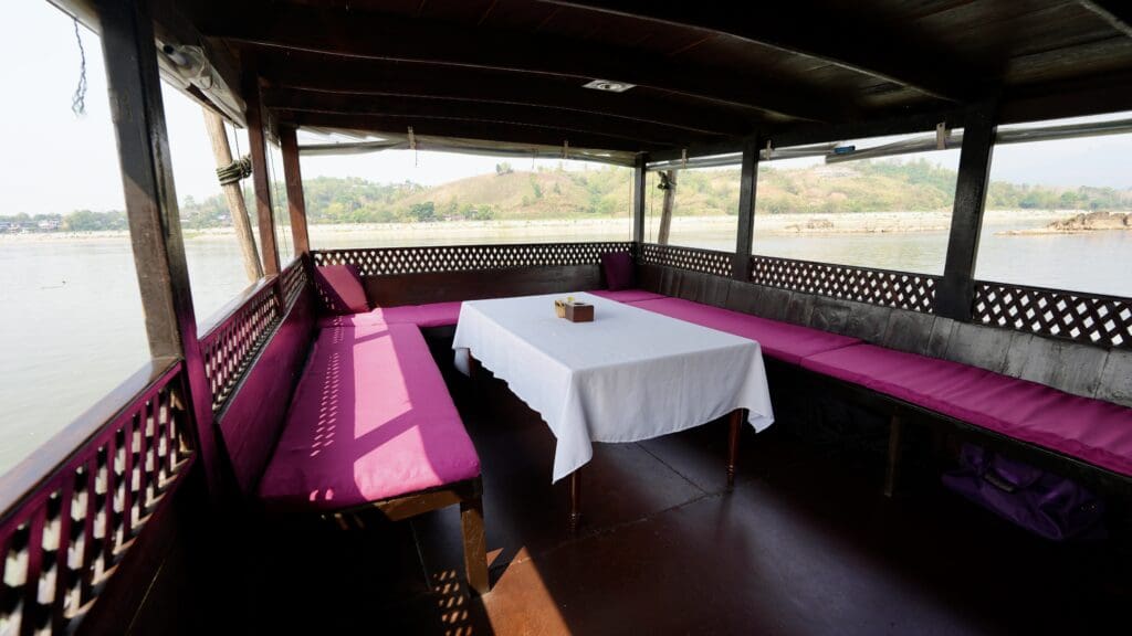 Dining area on long boat on Mekong River