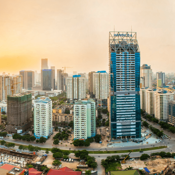distant view of tall buildings and skyscrapers with a sunset in background
