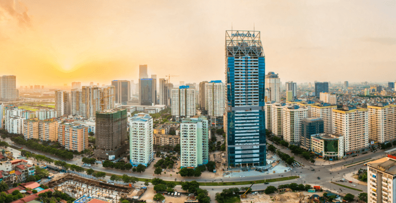 distant view of tall buildings and skyscrapers with a sunset in background