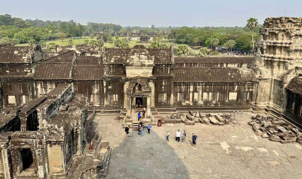ancient temple with people walking around inside