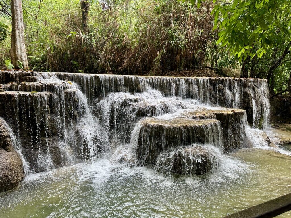 amazing cascading waterfall in wooded area