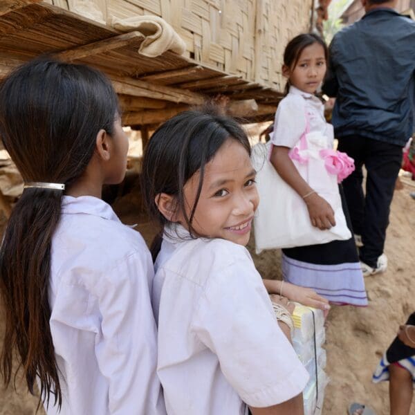 4 children walking along a street