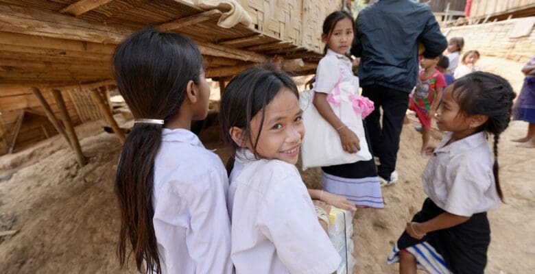 4 children walking along a street