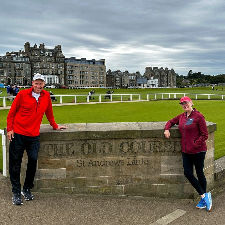 John and Bev Retirement Travelers standing at St. Andrews Golf Course