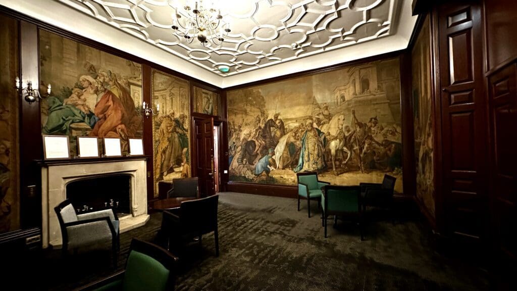 Inside view of a large room with wall painting at the Inverness Lochardil House
