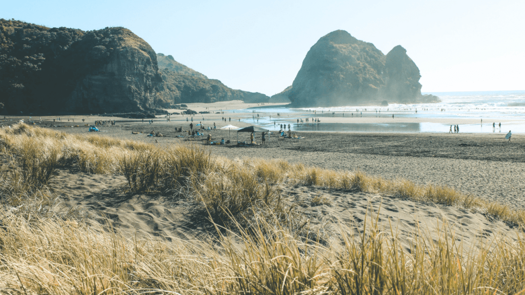 sandy shoreline with large rock formations