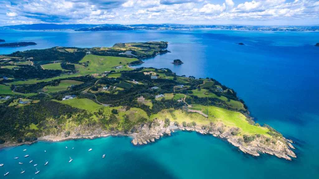 aerial view of a green island surrounded by blue waters