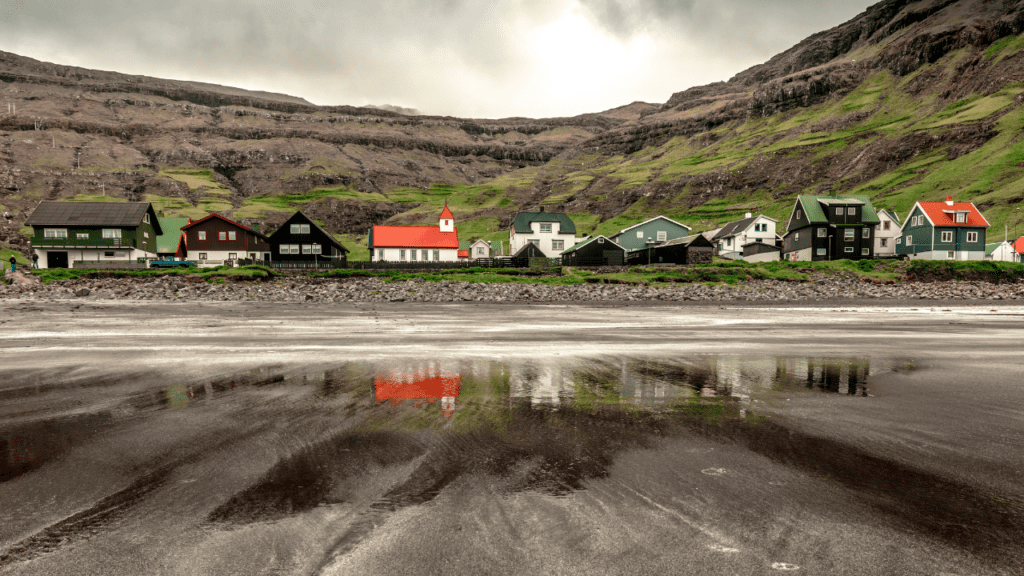 view from the water of Tjornuvik village in the Faroe Islands