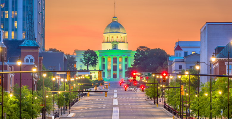 long streetview lined with streetlights with a domed building at the end