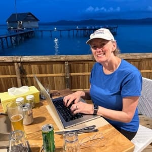 bev working on her computer at the raja ampat resort