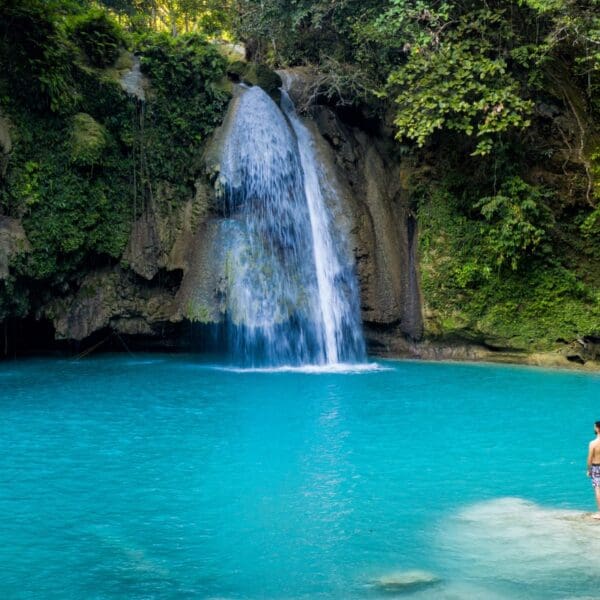waterfall in Philippines flowing into turquoise water