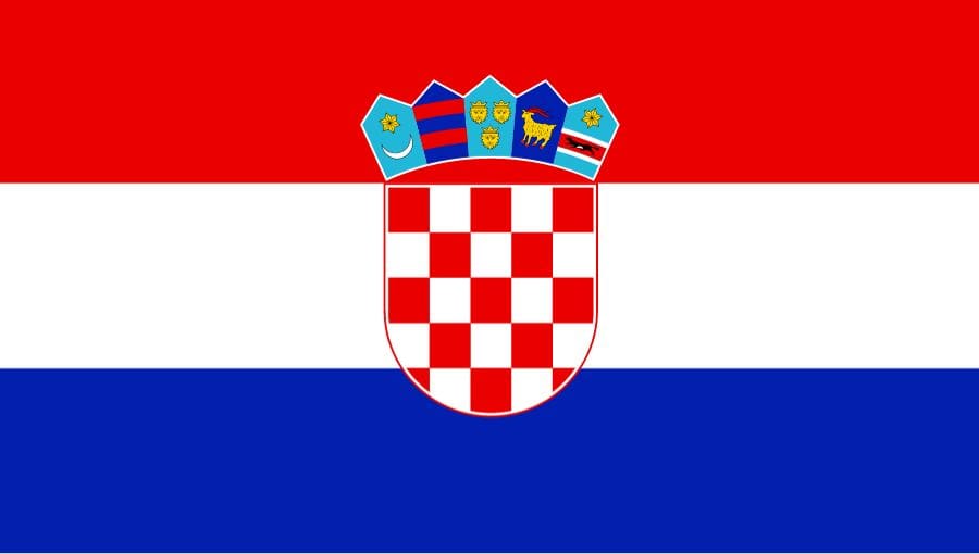 A red, white, and blue flag with an emblem in the center.