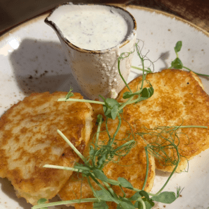 Potato pancakes with sauce in Vilnius restaurant