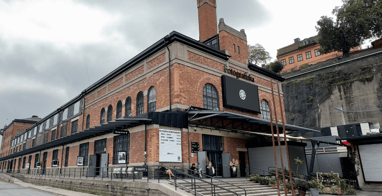 Long, brick building with arched windows in Stockholm