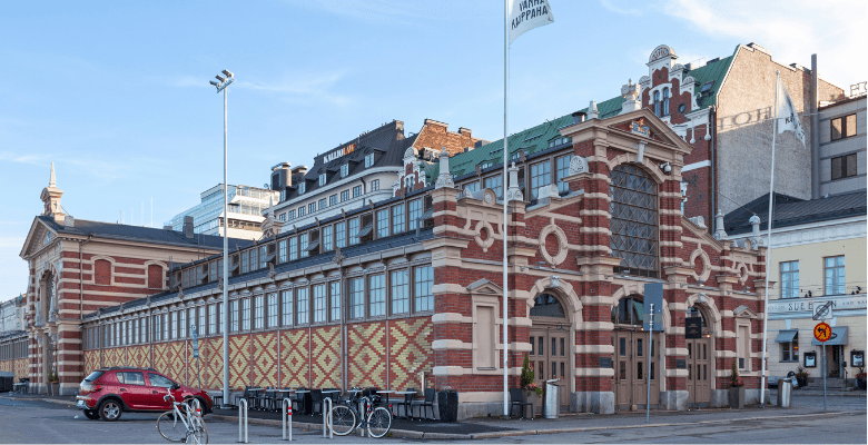 Beautiful red bricked building with arches in downtown Helsinki