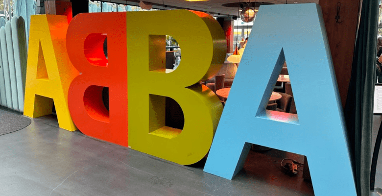 Large colorful sign with the letters ABBA