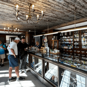John standing inside the Town Hall Pharmacy in Tallinn